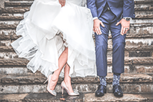 Shot of bride and groom in wedding outfits from the waist down